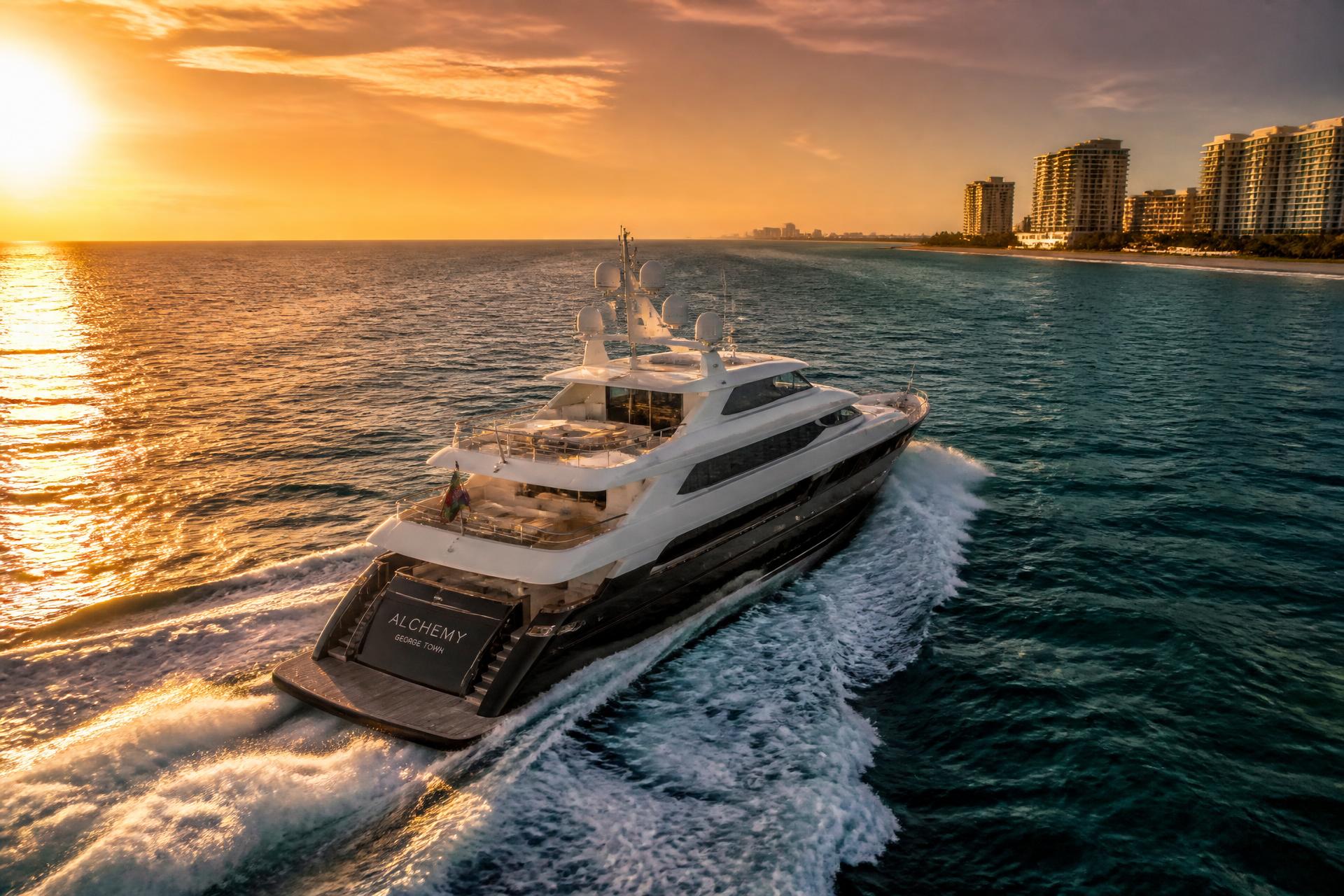 Luxury motor yacht cruising off the Boca Raton coast at sunset